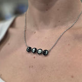 four moon lunar horizon in stainless steel