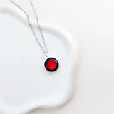 red moon moon phase image detail on 13mm charm, close-up