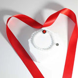 red moon celestial light bracelet laid flat showing charm placement and bead size