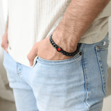 model wearing red moon titan bracelet in black matte on wrist, close-up