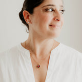 model wearing red moon simplicity necklace in gold