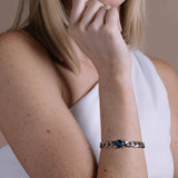 astral lunar curb link bracelet worn on wrist with charm centred